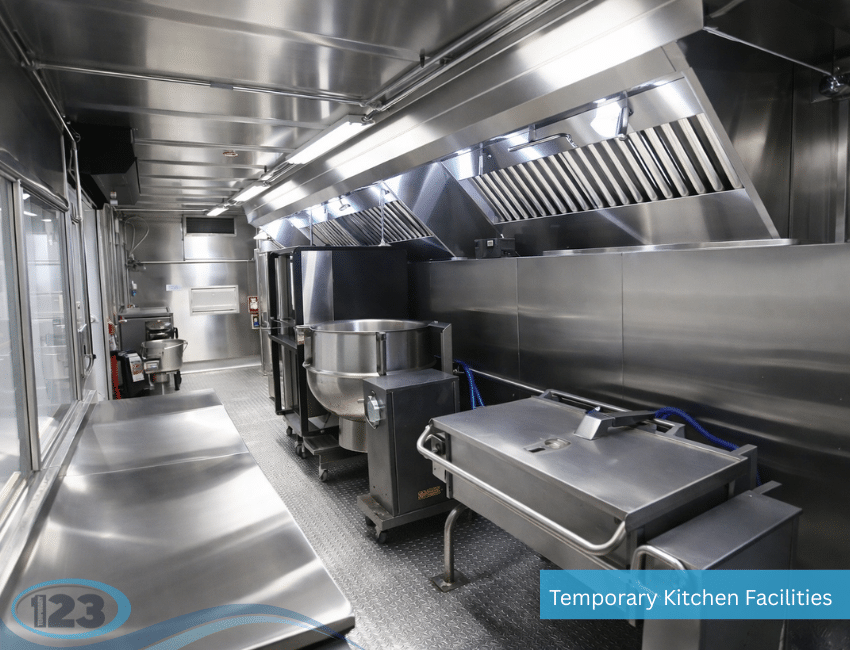Commercial mobile kitchen trailer interior with stainless-steel ventilation hoods and cooking equipment